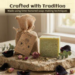 Bar of soap on a stone surface with decorative elements and text 'Crafted with Tradition'.