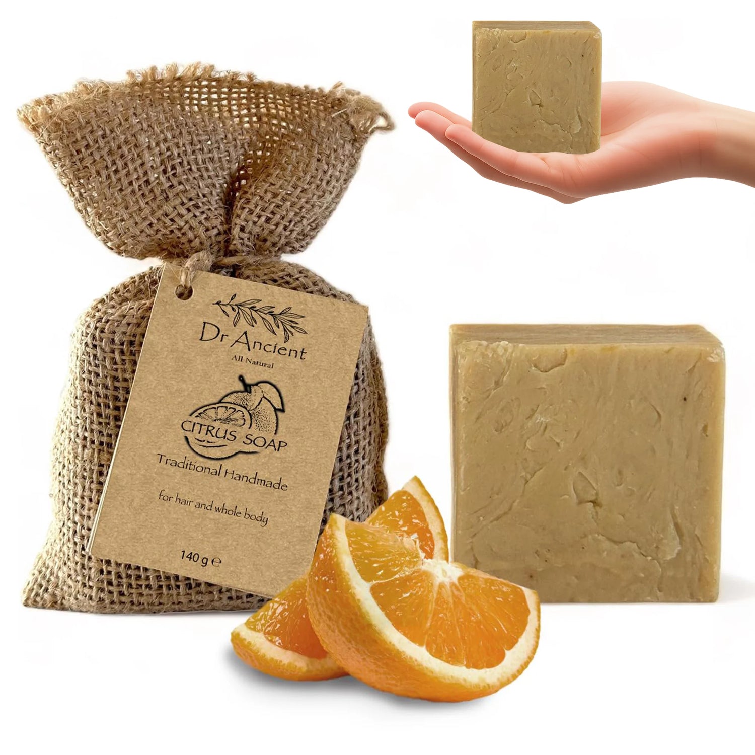 A bar of Dr. Ancient Citrus Soap body and hand soap shown with its burlap bag packaging, orange slices, and a hand holding another bar on a white background.