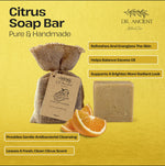 A bar of Dr. Ancient Natural Care Citrus Soap Bar shown next to a burlap bag and orange slices on a textured yellow background with promotional text.