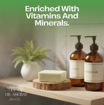 Bathroom shelf with bottles labeled 'Shampoo' and 'Conditioner', a bar of soap, and a plant, with text 'Enriched With Vitamins And Minerals' and brand name 'DR. ANCIENT'.