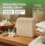 Block of soap on a wooden surface with flowers and a candle, featuring the Dr. Ancient brand.