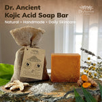 A bar of Dr. Ancient Kojic Acid Soap Bar displayed next to its burlap drawstring pouch packaging.
