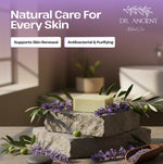 Dr. Ancient natural care products with lavender and olive branches on a stone surface.