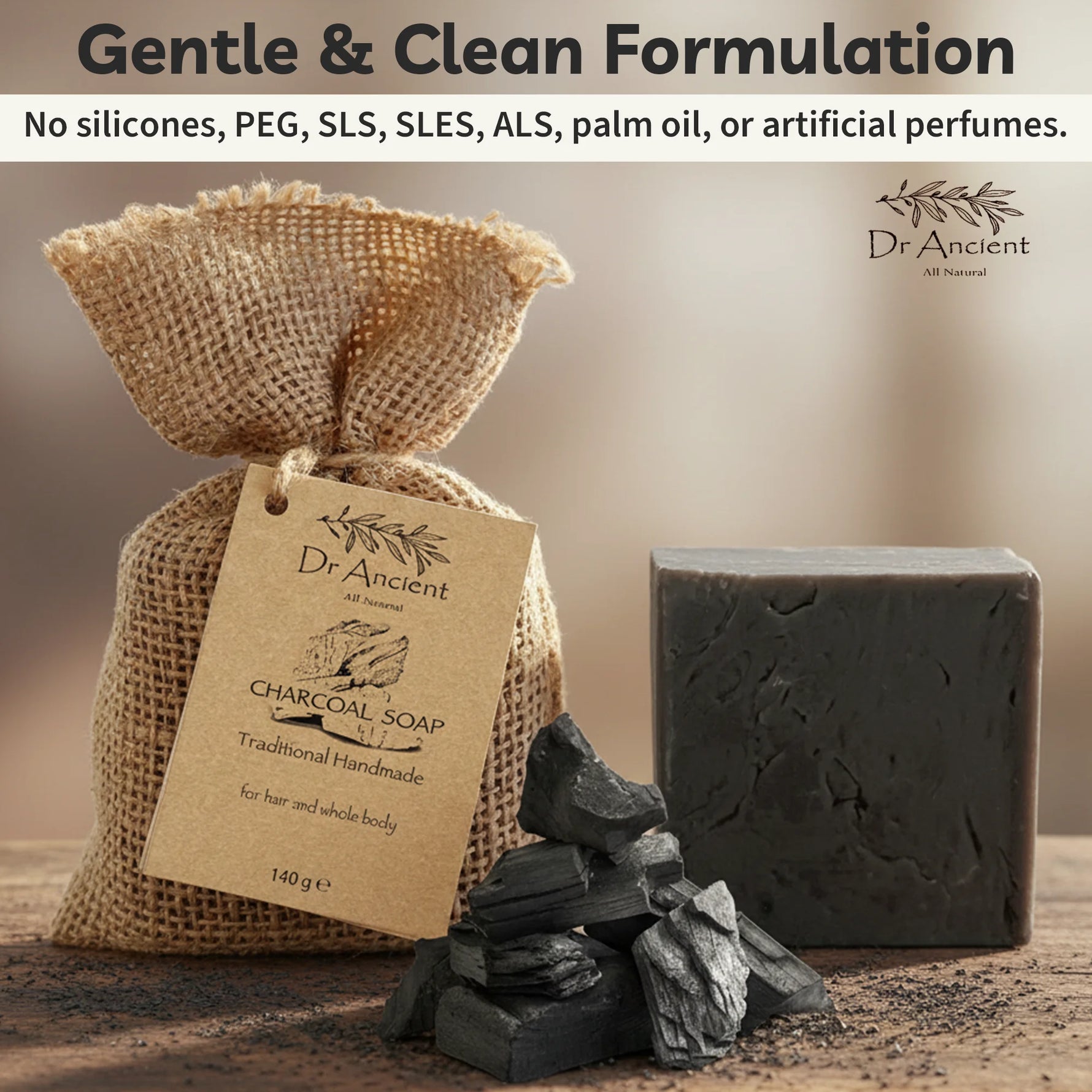 Dr. Ancient charcoal soap with packaging and ingredients on a wooden surface