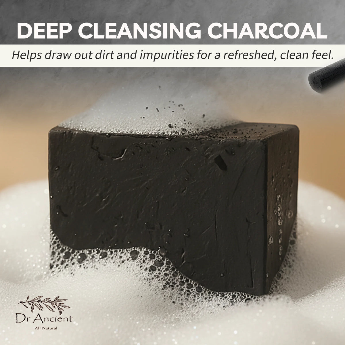 Block of deep cleansing charcoal soap with bubbles on a light background, featuring Dr. Ancient branding.