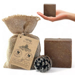 Dr. Incident soap with a burlap bag and pine cone on a white background