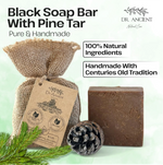 Black soap bar with pine tar from Dr. Ancient on a light green background