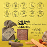 Dr. Ancient soap bar with packaging and natural elements on a yellow background