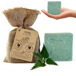 Dr. Ancient Stinging Nettle Soap with burlap bag and nettle leaves on a white background