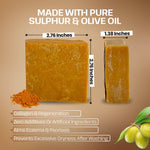 A bar of yellow-orange soap shown on a brown background with text reading 'MADE WITH PURE SULPHUR & OLIVE OIL' and dimensions labeled 2.76 inches by 1.