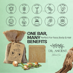Bar of soap with dimensions and organic ingredients on a green background