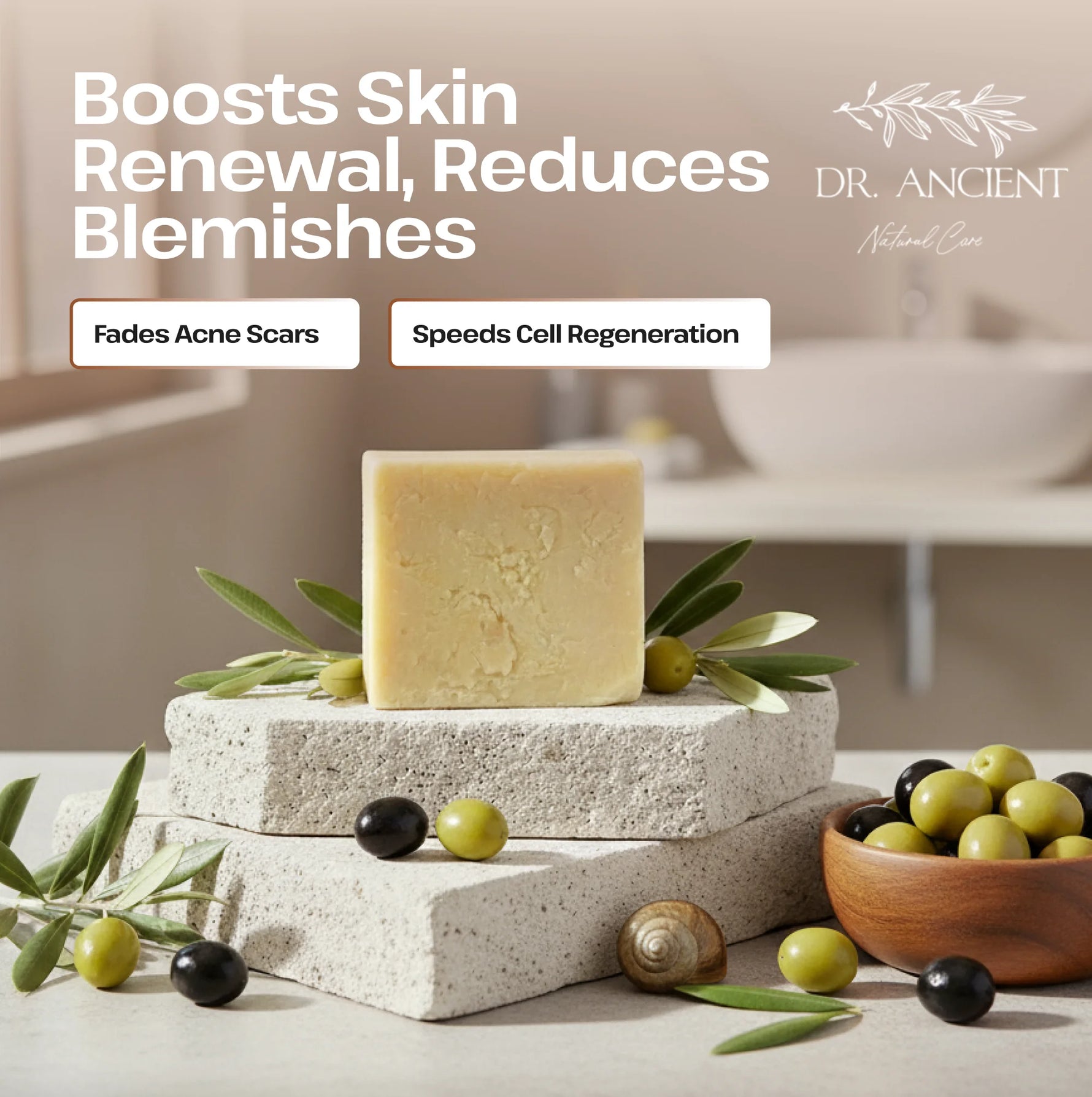 A bar of pale yellow soap stands on stacked stone blocks with olive branches, olives, and a small bowl of olives in a softly lit bathroom-like setting. Text on the image reads 'Boosts Skin Renewal, Reduces Blemishes' and includes the brand 'DR.