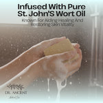 Hand holding a bar of soap with text about St. John's Wort oil and Dr. Ancient brand.