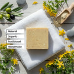 Bar of soap on a white towel with natural and organic text and DR. ANCIENT branding.