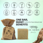 Dr. Ancient natural soap bar with packaging and branding on a light green background