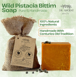 Wild Pistacia Bittim Soap by Dr. Ancient Natural Care, featuring a bar of orange-brown soap next to a burlap bag with a kraft paper tag, on a light green textured background with promotional text.