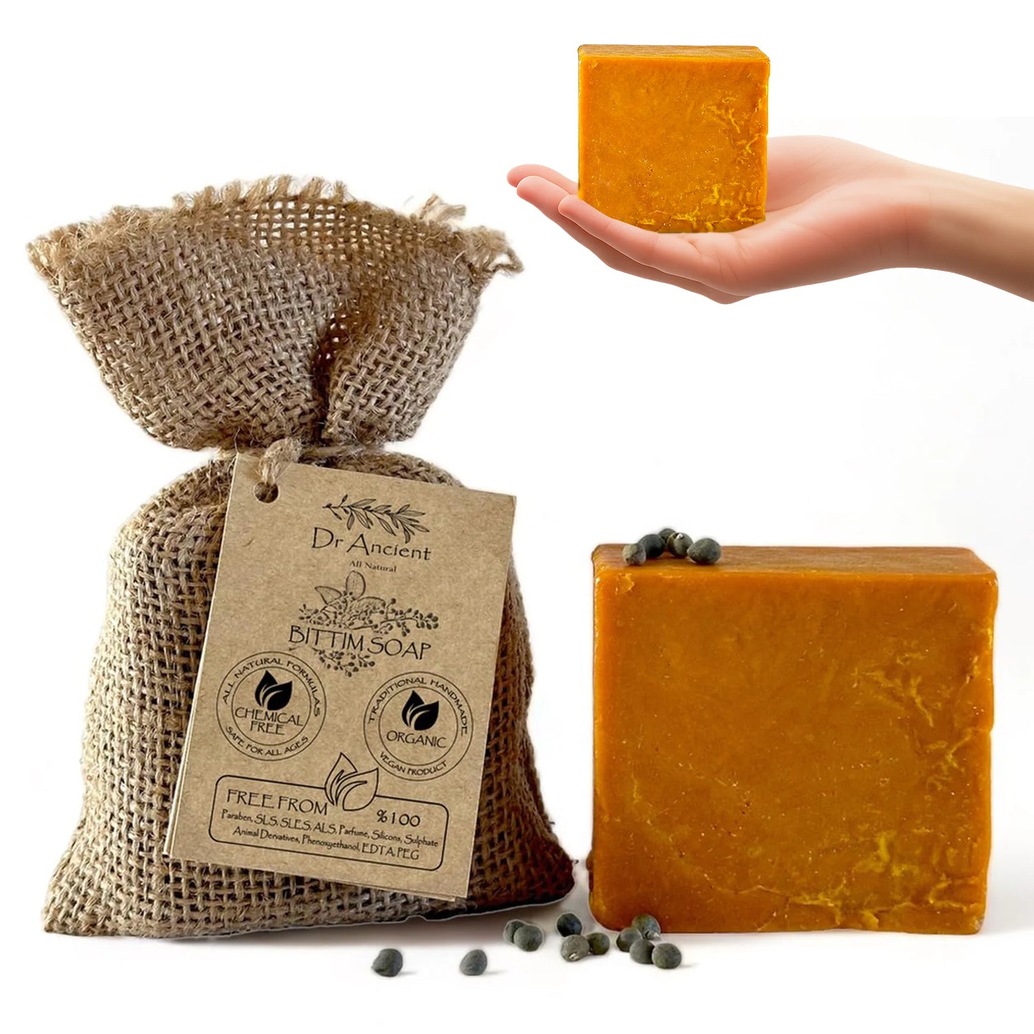 Dr. Ancient Betum Soap in a burlap bag with a hand holding a bar of soap on a white background