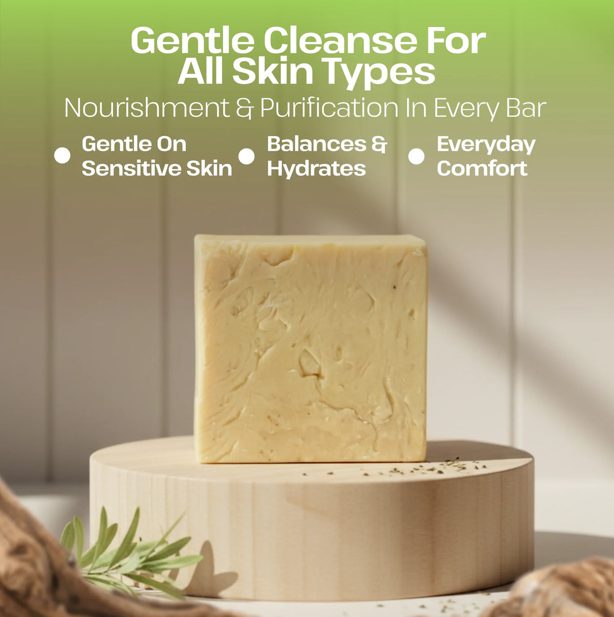 A pale yellow rectangular soap bar displayed upright on a round wooden pedestal, with marketing text above reading 'Gentle Cleanse For All Skin Types' and bullet points about nourishment, hydration, and comfort.
