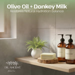 Bathroom shelf with olive oil and donkey milk products, featuring a plant and soap.